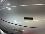 a close up of a car ' s hood with a sticker on it