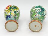 two vases that have been painted with flowers on them