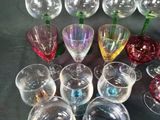 a lot of wine glasses that are sitting on a table