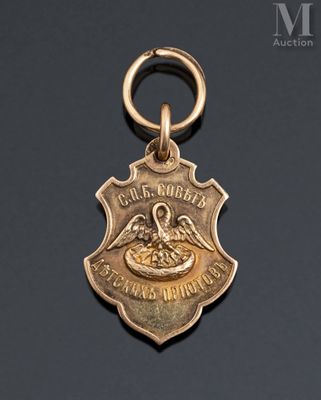 an image of a gold medal with a bird on it