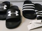 trois paires de sandales noires et blanches ornées de rayures blanches