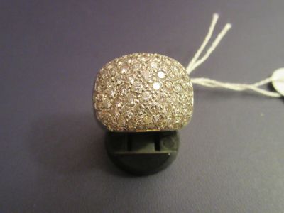 a gold ball with a string attached to it on a table