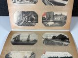 an old photo of an open book with pictures of a city