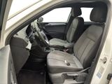 the interior of a car with the door open and the passenger seat down