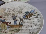 two plates with a picture of a man and a woman on them