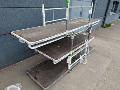 a hospital bed sitting on the sidewalk outside of a building