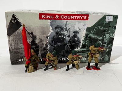toy soldiers are posed in front of a box with a flag