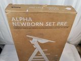 an open box of a new born set - up on a bed