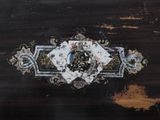 a close up of a piece of wood with a clock on it