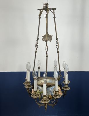 LONGCHAMPS. Lustre à neuf feux, la cuve en faïence émailée p…