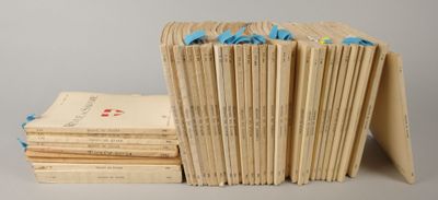 several books stacked on top of each other on a table