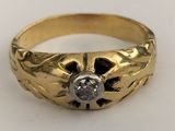an image of a gold ring with a diamond in the center