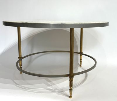 an image of a table with a marble top and brass legs