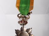 a medal hanging from the ceiling of a room