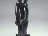 statue of a man and woman holding a baby