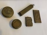 four different types of metal items on a white surface