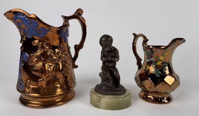 three different vases sitting next to each other on a table