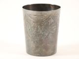 a metal cup that has a design on it