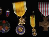 many medals and medals displayed on a black background
