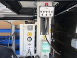 a machine that is sitting in the back of a truck