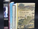 three books sitting on top of a table next to each other