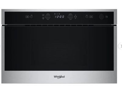 un gros plan d'un four à micro-ondes avec la porte ouverte