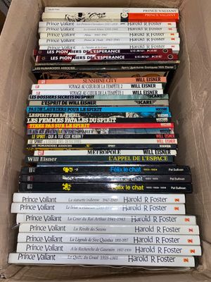 a lot of books in a box on the floor