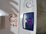 a white washing machine with a digital clock on it