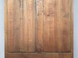 an old wooden cabinet with two doors and two drawers