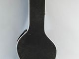an image of a black acoustic guitar case on a white background