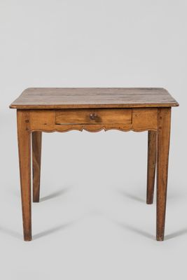 a small wooden table with a drawer on top of it