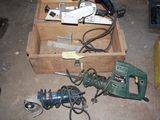 a box of tools that are sitting on the floor