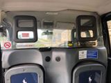 two seats in the back of a van with a no parking sign