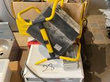 a pile of appliances and a sink in a room