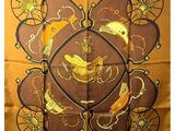 brown silk scarf with gold and black design of birds and bicycles