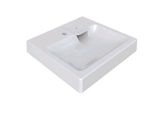the white sink is sitting on top of the white counter