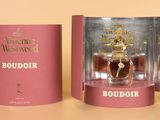 an image of a bottle of perfume in a box on a table