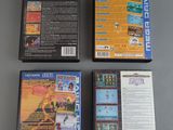 three video games are sitting on a table next to each other