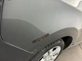 a close up of a car door with a sticker on it