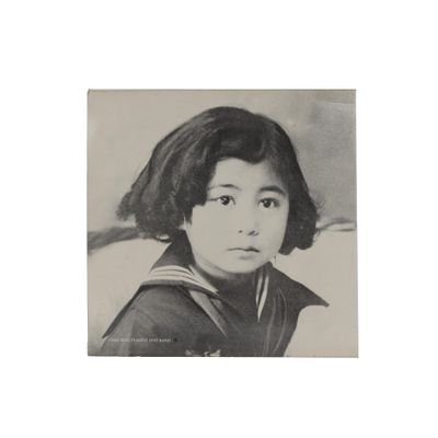 an old black and white photo of a young girl in a sailor ' s outfit