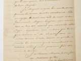 a handwritten letter written in french on a piece of paper