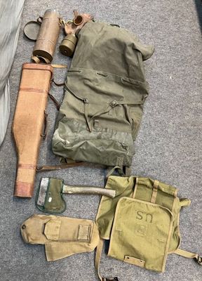 a lot of military items that are on the floor