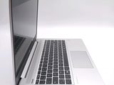 a laptop computer that is sitting on a white table