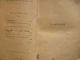 an old book opened to show a page of text