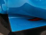 a close up of a blue vase on a black table