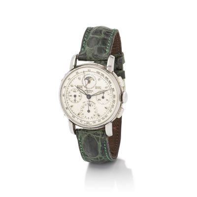 a close up of a watch on a white background with a white background
