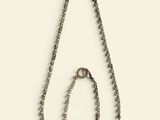 chain with a loop of silver beads on a white background