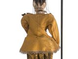 a doll that is hanging on a pole