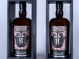 two bottles of artisant are in a black box on a white surface