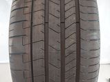 a close up of a tire on a white surface